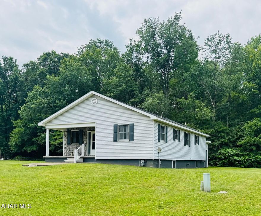 Welcome to this quaint cottage style home located in Portage Area School District. This welcoming home offers one story living at its best! Open the front door into the inviting living room with lots of natural light. The dining room is open to the well equipped kitchen with plenty of cabinet storage and counterspace. This home also offers 2 great sized bedrooms with great closet storage, and a hall bath that is completely updated. The spacious primary suite offers a walk in closet and of course its own updated bath. The full unfinished basement is ready for your design! Laundry hookups and a third bath is already plumbed. This beauty has upgrades throughout with oak trim, crown molding and solid oak doors. The exterior boasts an adorable covered front porch with stone accents and a fabulous flat yard for outdoor activities. This home is ready to go! Call for your showing today!