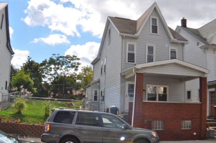 2.5 story 4 bedroom in move in condition nicely remodeled.vinyl siding replacement windows beautiful patio large fenced yard