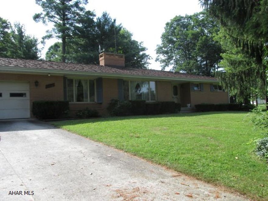 Solid built brick 1 story rancher, 3 bedroom, 3 bath, partially finished basement, 2 sided stove fireplace, 2 car attached garage with a 5 bay heated detatched commercial garage, so much potential, home needs some TLC.