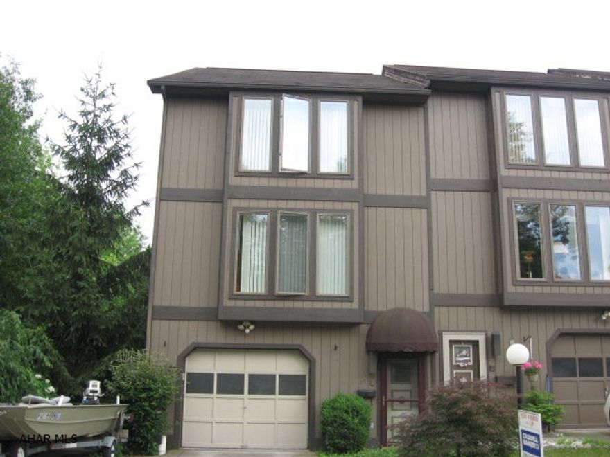 Corner townhome with double driveway and additional ground.  Spacious rooms. Covered patio plus deck.  Landscaping pavers surrounding a lovely pond.  No Association Fee.  Home Warranty Included.  Deed Restrictions.  Security System not activated.