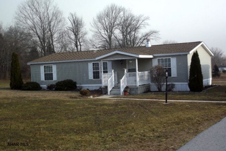 Well maintained, maintenance free double wide on 1.29 acres. This spacious 3 BR, 2 BA home features a relaxing year around sunroom. Oversized two car garage with supersized paved driveway. Relax in the back yard with firepit and garden pond. Don't miss this one!