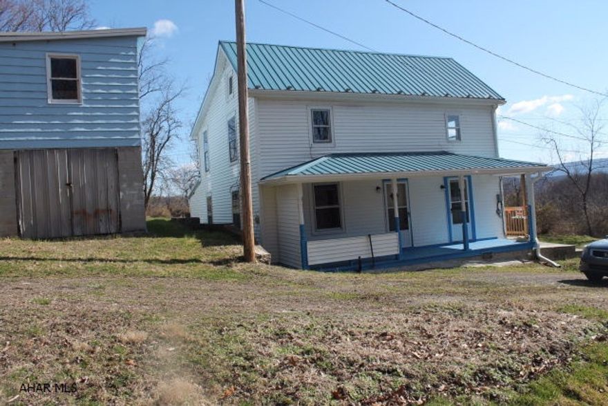 Large Starter home in the Mt. Union borough, this home has two separate entrances, and could be converted into two apartments, and an extra apartment above the two car garage. This property has plenty potential for either a large family or a great investment property.  There is also a large shed. New metal roof installed in 2014. Garage has private electric line & private septic tank.
