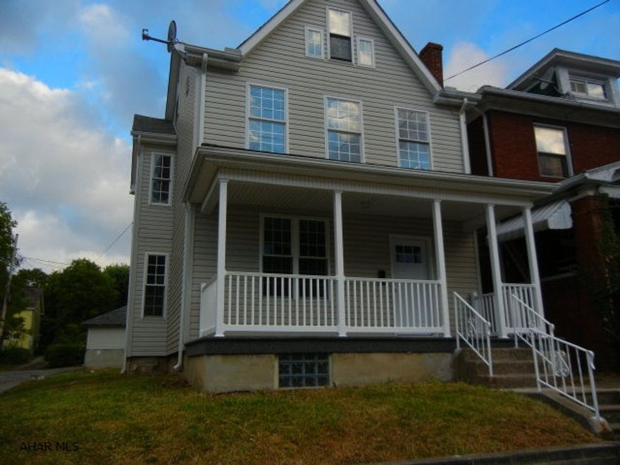 FRESHLY PAINTED INTERIOR.  TAKE A LOOK!  Newer furnace, windows, front door and porch railing.  First floor laundry hookups off kitchen.  Vinyl sided.  Det. garage has 3 bays which are rented at $25/mo/each.