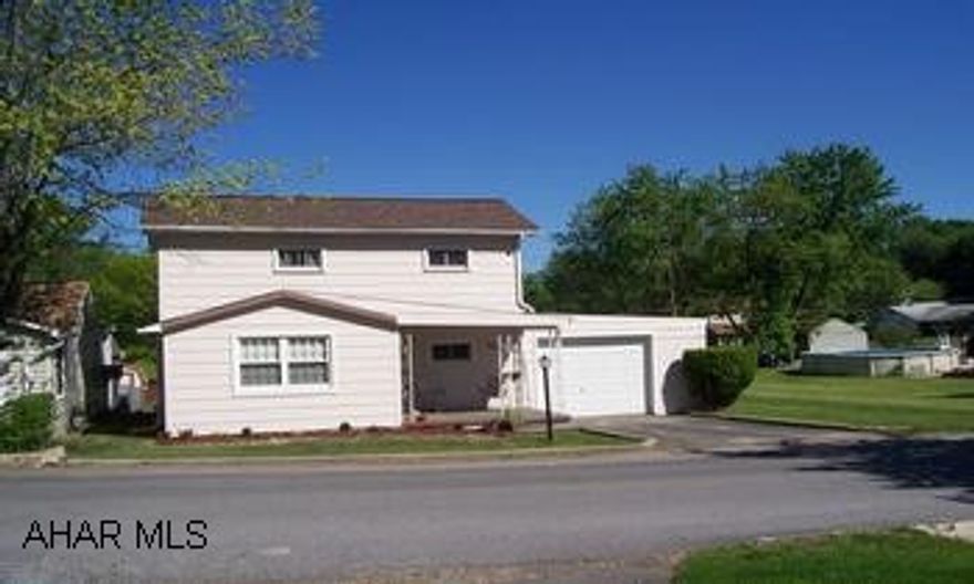 Nice 2 bedroom home, on a large lot.  Bonus room on 1st floor.  The driveway goes from the fromt of the property to the alley - right through the garage.  The kitchen is updated & offers a good bit of storage.  New windows, furnace, roof & storm doors. The driveway goes from the front of the property to the alley - right through the garage.  The kitchen is updated & offers a good bit of storage.  New windows, furnace, roof & storm doors.