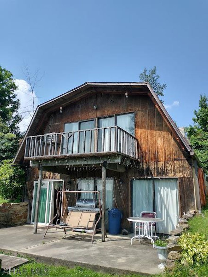 If privacy is what your looking for - this might be the perfect place for you... this chalet-style frame house sits on 3.0983 acres - the back yard borders the woods - Make this home your weekender, vacation rental or full-time residence. Balcony on the front of the house  let's you enjoy the beautiful Country Setting. The large yard gives you plenty of space for enjoying the great outdoors.