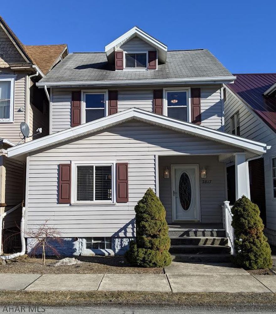 Bright & welcoming 3 bedroom home in a convenient neighborhood with a fenced yard and two-car carport. The first floor features a spacious living room with hardwood floors, a dining room with a large window and hardwood floors, and a kitchen with a breakfast bar. Upstairs, two of the bedrooms have hardwood flooring and the bathroom is updated. The third-floor walk-up attic has plenty of headroom- great for storage or to finish into livable space. This comfortable and cozy home is ready for new owners to enjoy its outdoor living space, convenient location, and delightful updates. Without hesitation, this home is worth a tour!