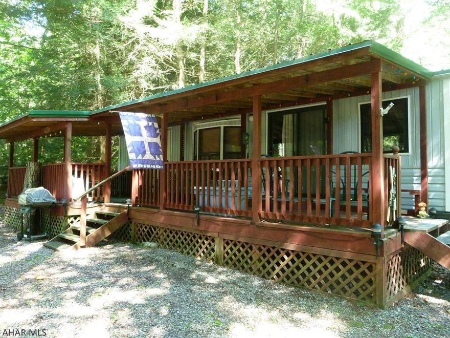 Out in the woods is where camping is best.  This double lot with park model camper and shed will make you feel you are in the middle of nature while enjoying the comforts of home.  Great fire pit for burning your hot dogs and making smores.  Two bedrooms offers room for the whole family or extra friends.  A new metal roof was just installed last year protecting your investment and giving you peace of mind for years to come.  Thinking of spending time here in hunting season or in the colder months?  There is extra insulation in this unit to help keep you warm.  The shed has electricity to run or charge your toys and tools.  Located in Glendale Yearound a gated recreational community adjacent to Prince Gallitzin State Park / Glendale Lake.  Six miles from Rock Run ATV Par,