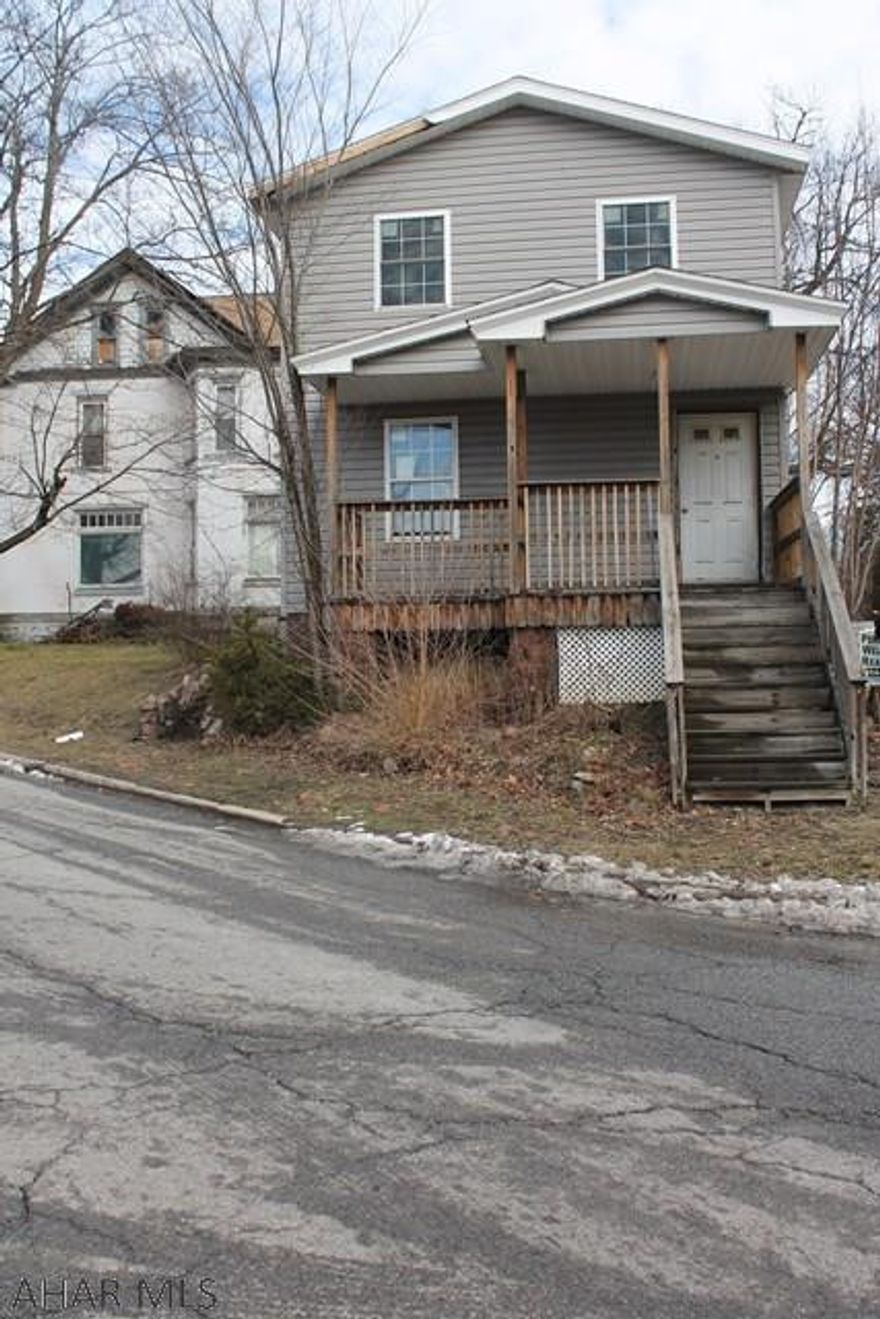 This property is a Handy man special..The outside has been remodeled with new windows, vinyl siding,roof,.The first floor has been gutted from fire damage,the 2nd floor has been gutted also from fire damage .Home also needs new furnace and more. Was once a great rental property.Take a  Flash light  .