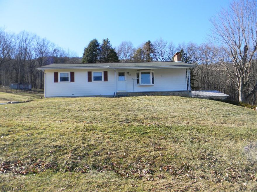 Beatiful ranch style home . Country setting with view. Close to town . Features 3 bedroom , new kitchen cabinets  And a nice space outdoor area . Parking pad for your camper with electric. Outside wood and coal stove . HOME WARRANTY INCLUDED !