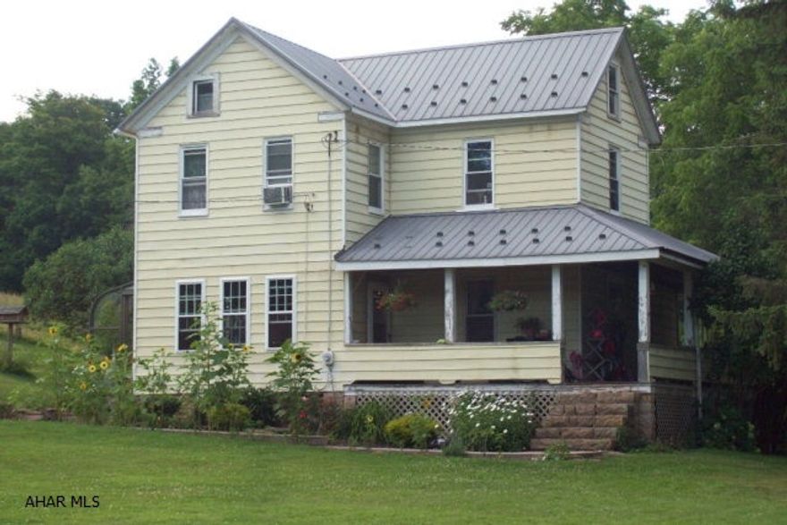 Renovations include new wiring, insulation, painted drywall, thermopane windows, newer metal roof, 10-oil furnace, hardwood floor in the kitchen and dining room. Dining room opens to a sun room.  Updated kitchen with hickory cabinets.  The living room has carpet flooring, half panel and painted drywall. Includes a 30x50 bank barn with water, 24x30 detach garage.  About 15 acres of fenced pasture ground, open fields and some woodland.