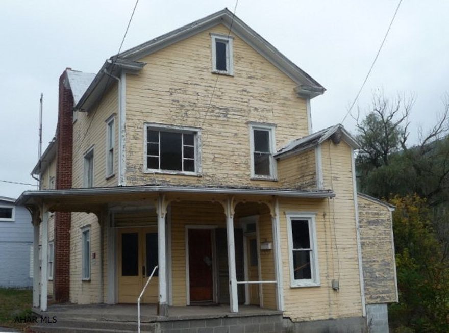 Former Loysburg Post Office. Spacious two story building offering space for a possible small business w/ storage and a nice two bedroom apartment on the second floor.