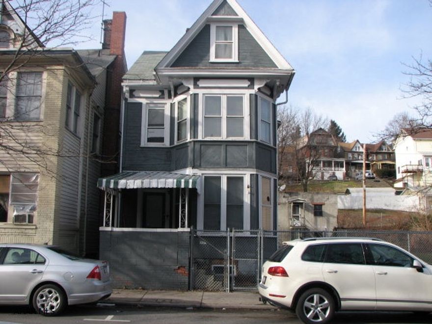 2 unit home in Historic Downtown Altoona.  1 block from City Hall and short walk to hospital make this a great investment property for those rental investors.  3 lots separated on individual deeds.  If new buyer will merge they  should be able to get a on taxes. Some renovations were completed on 2nd floor.   Also you will get the two - 2car garages that come with.  Rent the garages out as well.  this is definably a winner for you inverstors.