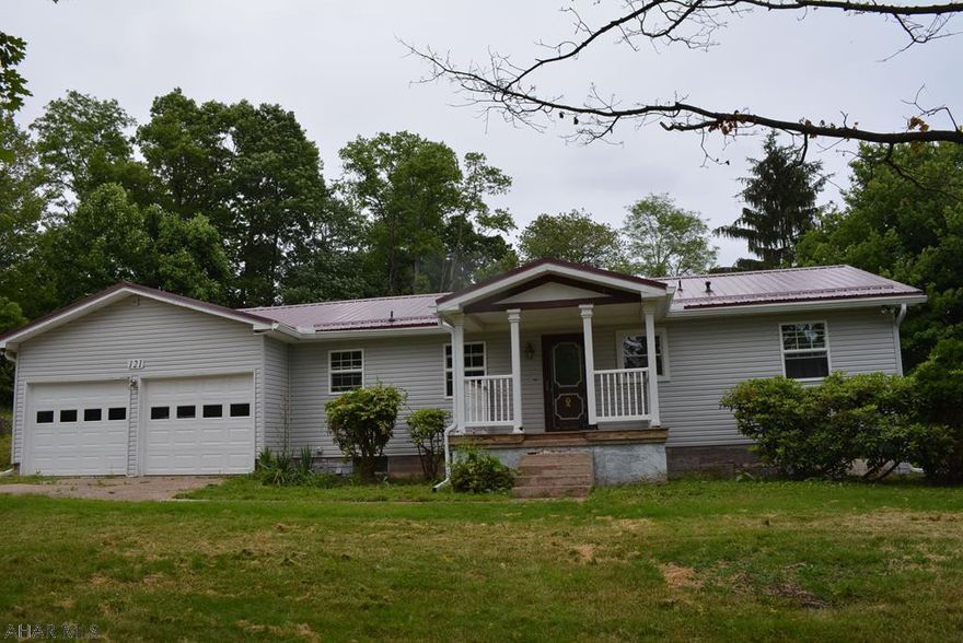 Looking for a one story house?  Here it is!  This is a nice 2 bedroom rancher on almost an acre in the Hollidaysburg SD.  It features new carpeting, new roof, new 200 amp electrical box, and new garage doors.  The living room is large and roomy with a bay window to the back. There is a pond area and lots of landscaping out back around the patio area.  The basement can be finished for a great family room.  Come take a look and make an offer!