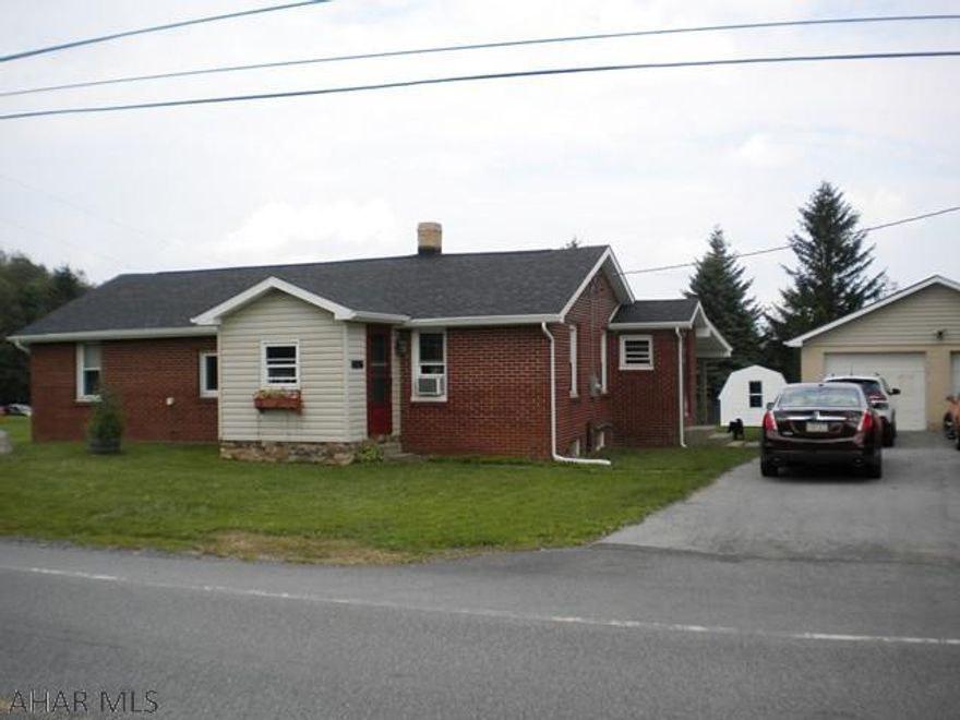 Blair Co. New 200 amp electric. Gas line ran to house. 1st Floor laundry. French drain. Some new windows. Shed. Garage door opener-No transmitter