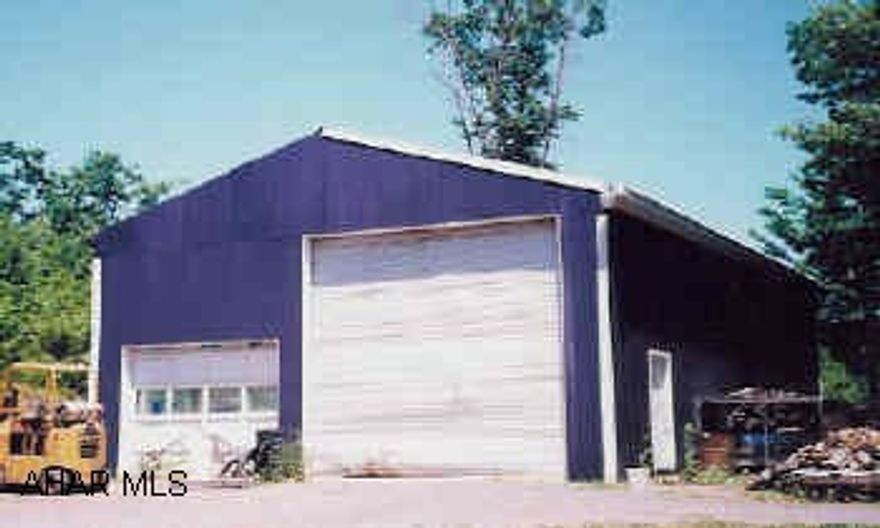 Commercial pole building 30'x50'. Fully insulated with 200 amp service. 12" reinforced concrete floor. 112 sq.ft. suspended ceiling. On 2 acres fronting route 26.