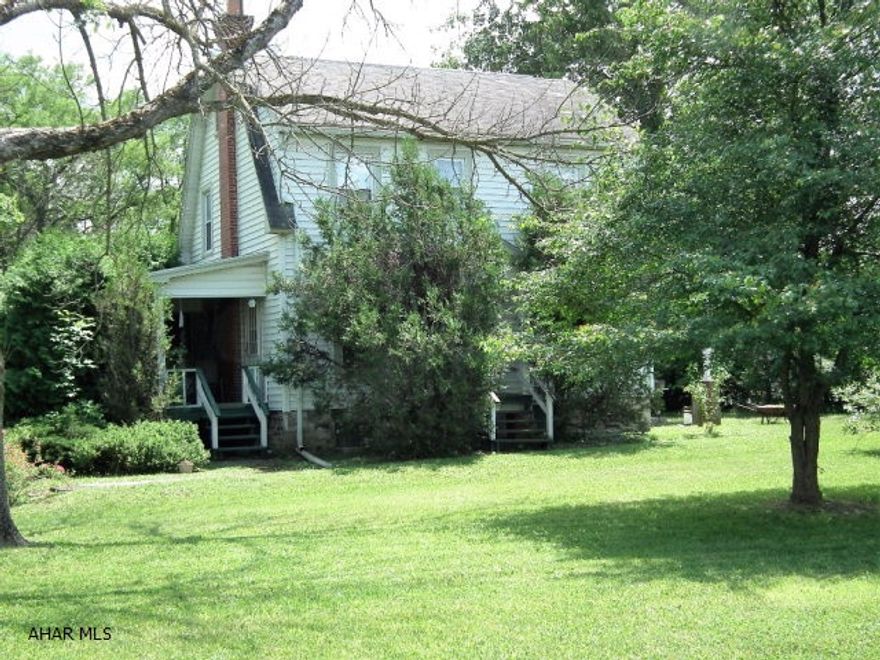 1.63 acre lot used as residential, could be commercial. House is vinyl & color lok, 3 bedrooms, 2 full baths (1st and 2nd floor) and central air. Home needs TLC.