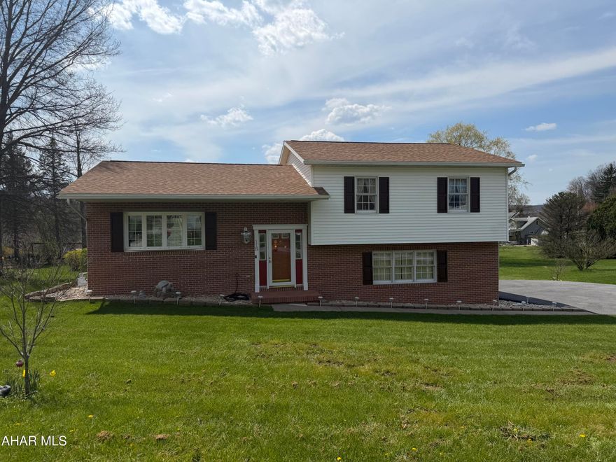 Nestled on a .41-acre lot in Belaire Estate, this charming multi-level residence--crafted by Elmer Bathurst--offers space, comfort, and flexibility. Step inside to a welcoming foyer with closet storage that flows into the formal living room. The adjoining dining room opens to the sunroom, filling the home with natural light. A spacious kitchen, full bath, and two generous bedrooms round out the main level, including a primary suite with its own private bath. Storage is abundant throughout. The second bedroom can be easily converted into 2-3 bedrooms.

Downstairs, the inviting family room features a gas fireplace and half bath, creating the perfect place for gatherings or quiet nights in. Outside, enjoy a level, landscaped yard, patio area, large paved driveway, and two utility sheds. The home also features a newer central air system, an oversized integral one-car garage, and convenient three-point entry. Minutes from I-99 and an easy 30-minute commute to State College. Located in the Bellwood-Antis School District.
