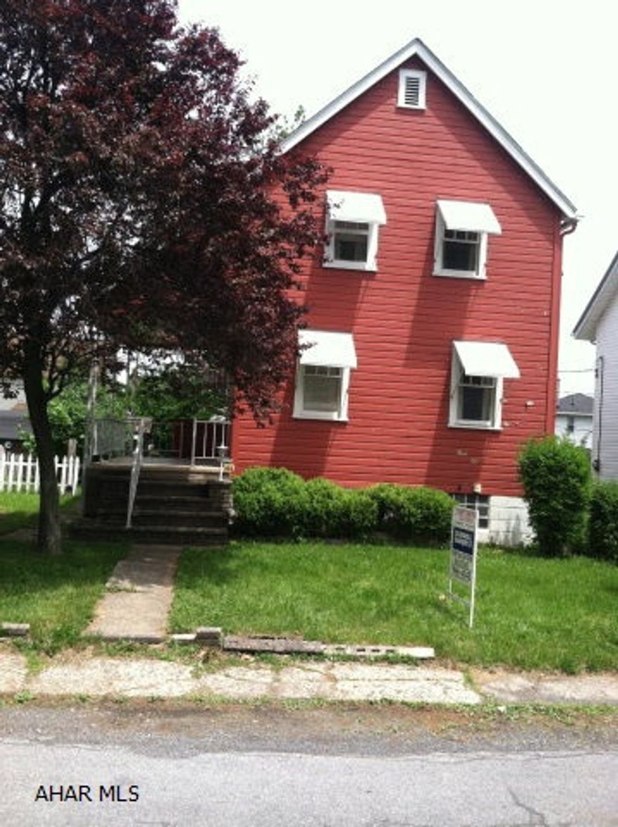 Possibilities abound with this home in the Toy Town area.  Sit on the front porch and relax enjoying the outdoors.