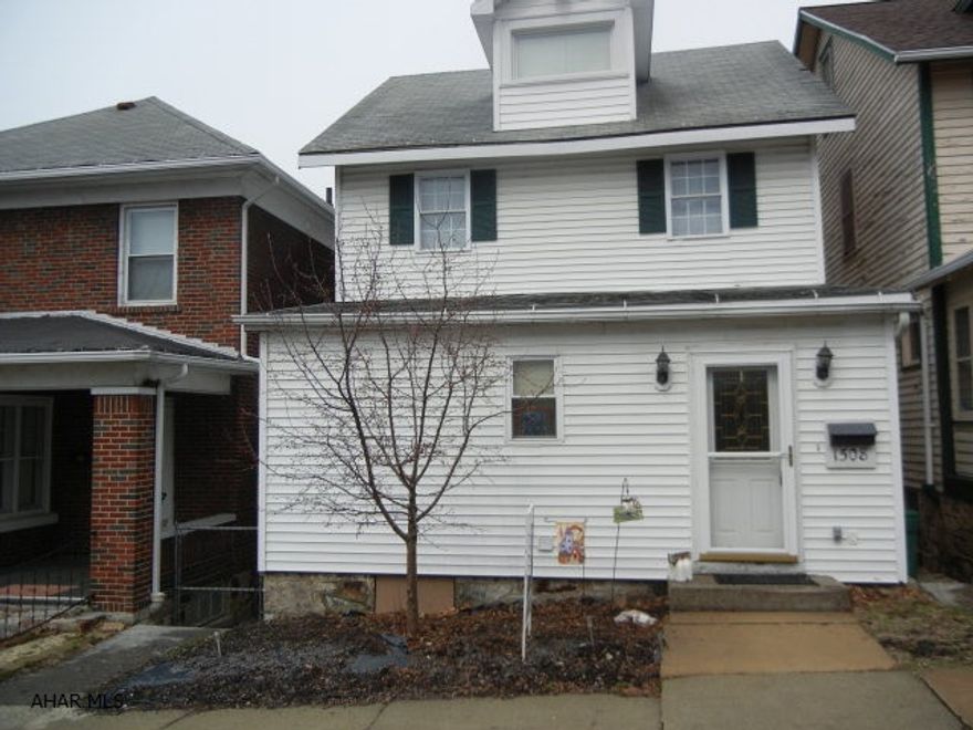 A MUST SEE!!   Awesome kitchen with oak cabinetry and eating area, also center island.  3BR (4th in attic), 2 baths.  1st floor laundry and full bath.  Central air, 4 season room, 1 car garage (currently used for storage, needs garage door). Low utility costs.  Average utilities - Gas $53, Electric $65, Water & Sewer $45, per month!  Home warranty included.