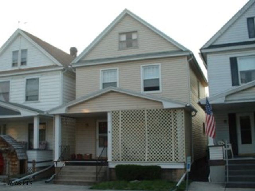 A beautiful well cared for, 3 bedroom, 1 bath, 2 1/2 story.  Gorgeous kitchen, living room with fireplace, attractive decor.  Off street parking, carport, covered porch and patio.  A must see!