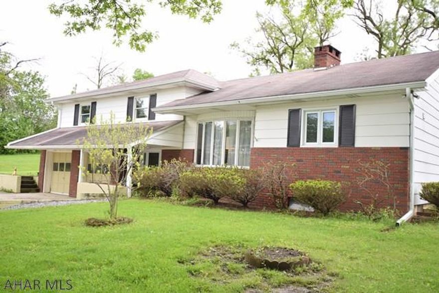 It feels like country living, but it's right in town not far from the Wye Switches and Holiday Hills development.  Large, private lot in quiet location.  Good mechanics.  This solid and spacious house is waiting for someone with decorating style and vision to make it the perfect home.