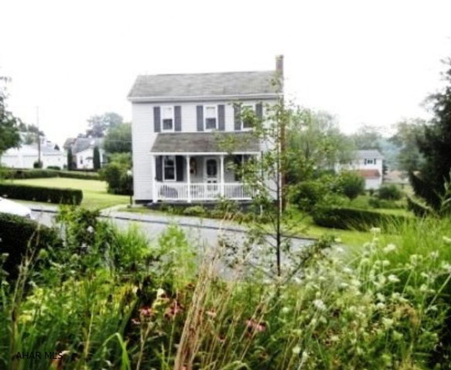 Cozy well kept home on almost 1/2 acre lot.  Hardwood under carpet. Newer furnace, roof, windows, siding, electric, and plumbing.  Beautifully landscaped with lighting, nice neighborhood, parking pad and paved alley.
