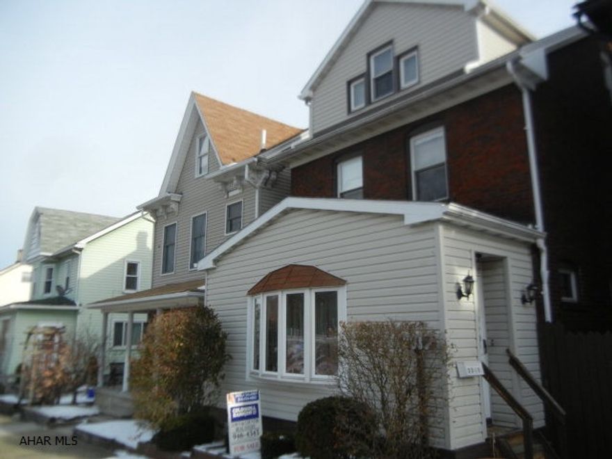 UPDATED BRICK! Many updates to systems and dcor make this come a comfortable family home!  Newer roof, furnace, central air, thermopane windows.  Beamed ceilings, gas fireplace, large covered deck and cement parking pad.  Finished 3rd floor would be great 4th bedroom, media room or family room. Located on low traffic street, but close to bus transportation, shopping and recreation.