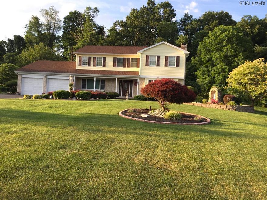 Extraordinary custom built home on 1.5 acres just minutes to Bedford, Everett, Pa Turnpike,1-70 and 1-99.  This is an  impressive 2 story colonial style home with beautiful landscaping, great rear patio, covered front porch, blacktop driveway and two car garage.  Open concept kitchen with island bar, cherry cabinets, formica counters, recessed lighting and dining area.  Formal dining and living room, family room with fireplace and attached sun room with floor to ceiling windows.  First floor laundry with tile floor and one half bath.  Second level has a master bedroom with walk in closet and master bath.  Four more bedrooms, one currently used as an office and another full bath. The basement is finished with a wet bar, exercise room, pool table and plenty of storage.  Wonderful property.