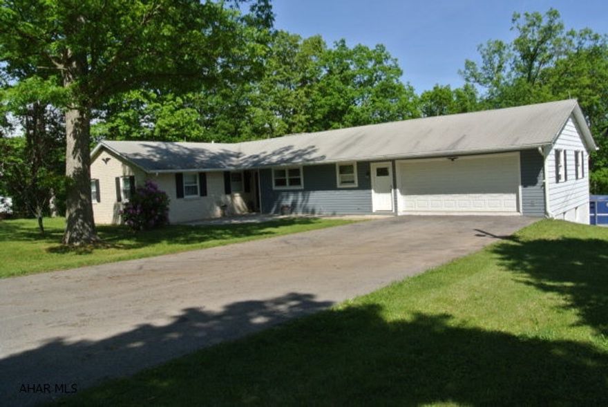 If you ever wanted a beautiful home in the country, look no further!  This stunning 4 bedroom home has been completely remodeled with impressive character.  This home offers a fantastic open floor plan on the first floor as well as the finished lower level.  Every room in the home is very spacious, with its own uniqueness.  And...the outside is just as impressive.  You have your own private pond stocked with bass, trout, and more that is fed via a local stream.  Part of your acerage is pasture for livestock.  Get this...you have 2 driveways and 2 garages...with plenty of room in the rear to park your RV!  Along with the central a/c with a heat pump, fenced area for horses, and the private rear setting...this home is a steal!!!