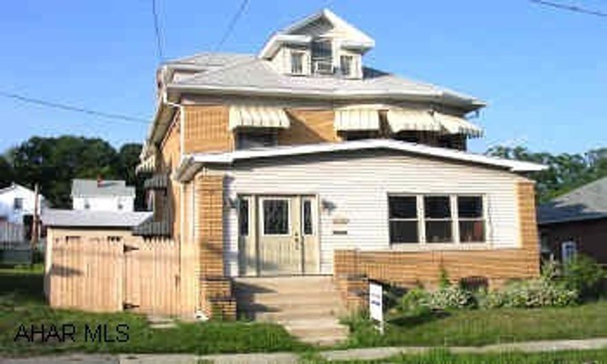 NEW CARPET, LOTS OF NATURAL WOODWORK & LEADED GLASS. HARDWOOD FLOORS ON 1ST FLOOR. TILT-IN WINDOWS. FOUR CAR BRICK GARAGE. FENCED YARD. CENTRAL AIR. PRICED TO SELL.