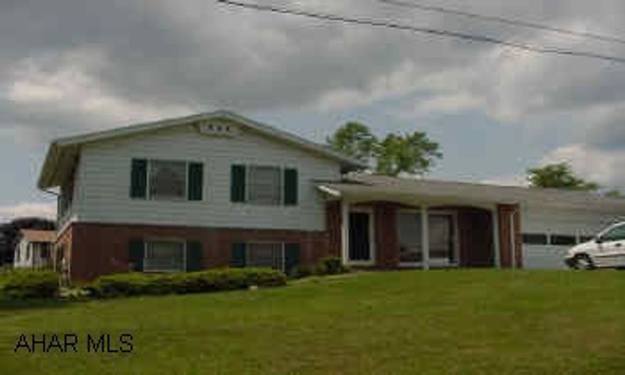 Bright 3 or 4 BR split level. Beautiful Living room with stone FP and skylights.  Quiet street. Beautiful hardwood flooring and some new carpet.  Newly painted.  Great house!