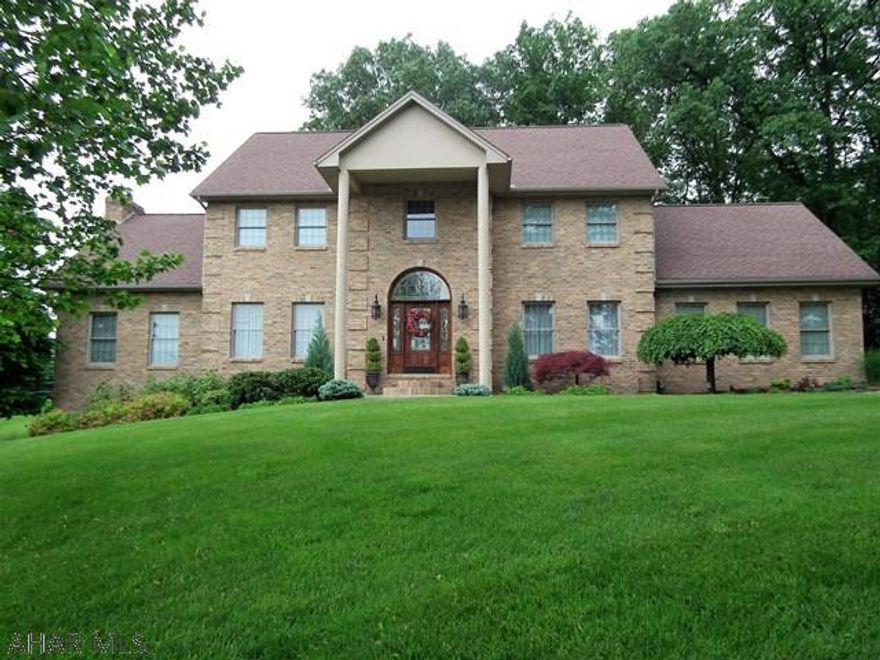 Has all the "I Wants", beautiful curb appeal. Private back yard, covered deck, attractive landscaping, over-sized 2 car garage and that is just the outside...In side vaulted entrance, formal living and dining room, large kitchen with granite counters and eating area, Great Room with brick wall fireplace, 4 bedrooms and 4 full baths, 1 half bath, 3 zone, family room and office in basement.