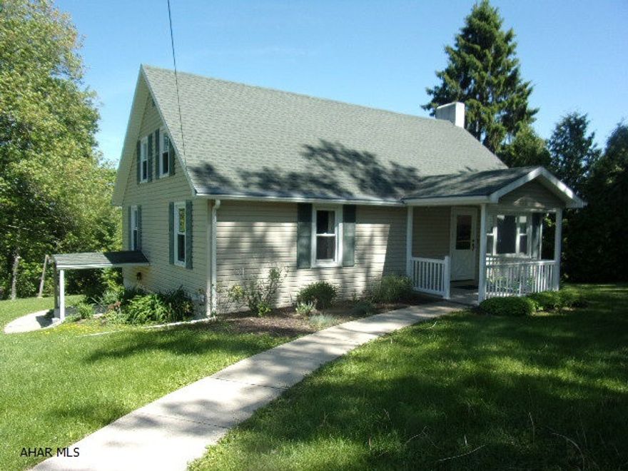 Nicely maintained 1.5 story with vinyl siding, central air conditioning, and super rear porch overlooking the mountains.  First floor bedrooms and 2 full baths.  Great neighborhood off the beaten path! Hardwood floors under carpeting on 1st floor.