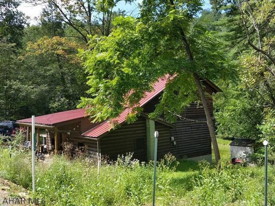 Only 4 miles to Snyders Run Boat Launch and 1.7 miles to Ridenour Overlook at Lake Raystown!!! (Look at the photos)! Enjoy your cabin with 2-story addition on approx 20 ACRES!!! Great for hunting and a getaway. 1.5 baths and gigantic spare room for your family and guests! 28 x 40 Metal building for your boat plus 2 sheds, and a fire-ring for camp fires.  J-402