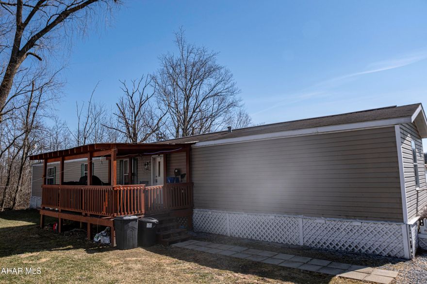 This  well-maintained champion single-wide mobile home offers comfortable living on a rented lot. The home features three bedrooms and two full baths, providing ample space for individuals seeking a comfortable living space. The interior is bright and airy, with a cozy living room, a functional eat-in kitchen. . 

A generously sized deck extends from the entrance of the home, offering a perfect spot for outdoor relaxation and entertaining. Lot rent is 455.00/ month. which's includes sewer and garbadge.Schedule your tour today.