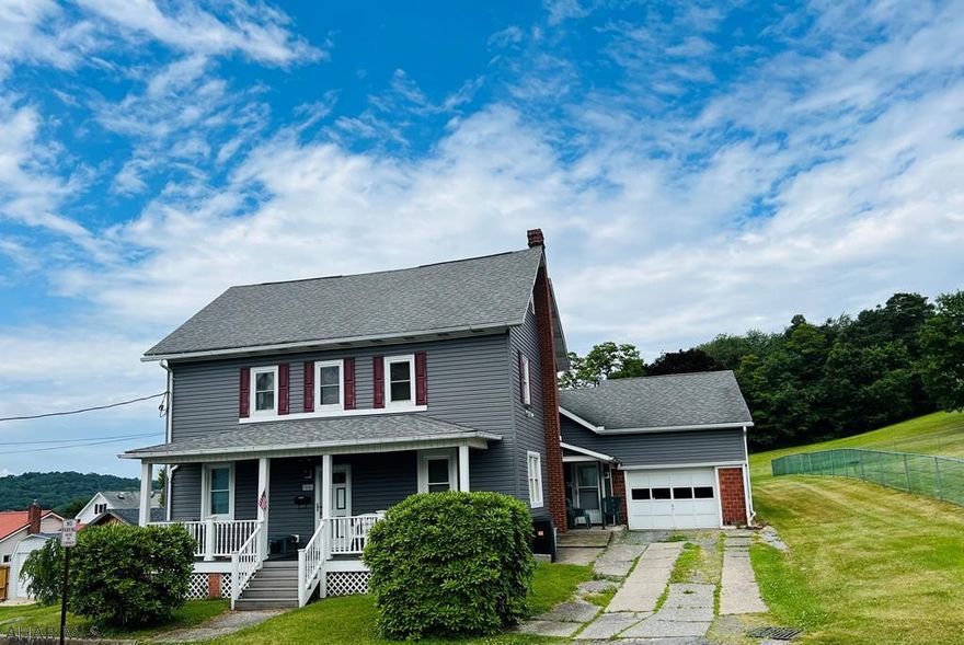 Charming Single family home which could easily duplexed. 5 Br, 2 full bath, 2 kitchens. One car attached garage on the edge of town. Newer roof, siding and windows. All new floor coverings.  this home is situated on almost one acre.