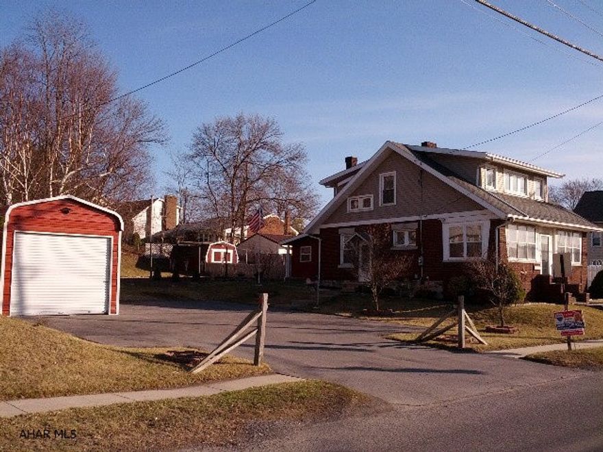 Meticulous home, beautiful woodwork & hardwood floors, formal dining room with french doors and leaded stained glass windows in both the living room and dining room, also vinyl tilt windows, brick fireplace and built-in bench seat in living room. Heated sunroom plus heated enclosed front porch, garage, blacktop drive and great landscaping on spacious 100 x 120 lot. Included are: pellet stove, refrigerator, stove, microwave, window treatments, toaster oven, shed, 3 air conditioners, and gas log insert in fireplace, fenced yard, 1-car garage and nice patio.  #J-247