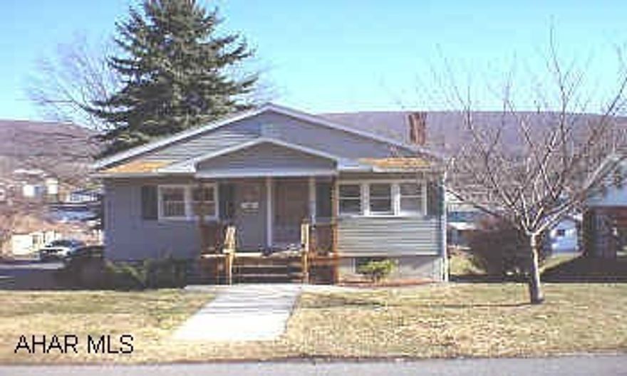 1 story 2 bedroom home with oak kitchen, newer roof and vinyl siding, covered deck on a corner lot.