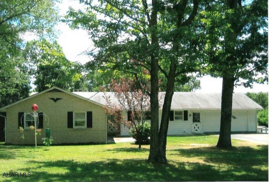 Home built in 1975, has very good bones. 4BR/, 4 garage spaces, central air, wood fireplace in basement area with lots of potential. Property is 11.6 acres, has paved drive, small shed and pond. Great location.