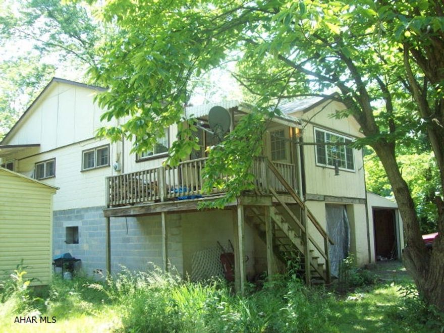 Great weekend retreat or year-round living!  Rear deck overlooks the Juniata River.  Large lot with room for picnicking.  Cute two bedroom with modern kitchen and appliances.  Living room and dining area have natural wood paneling.