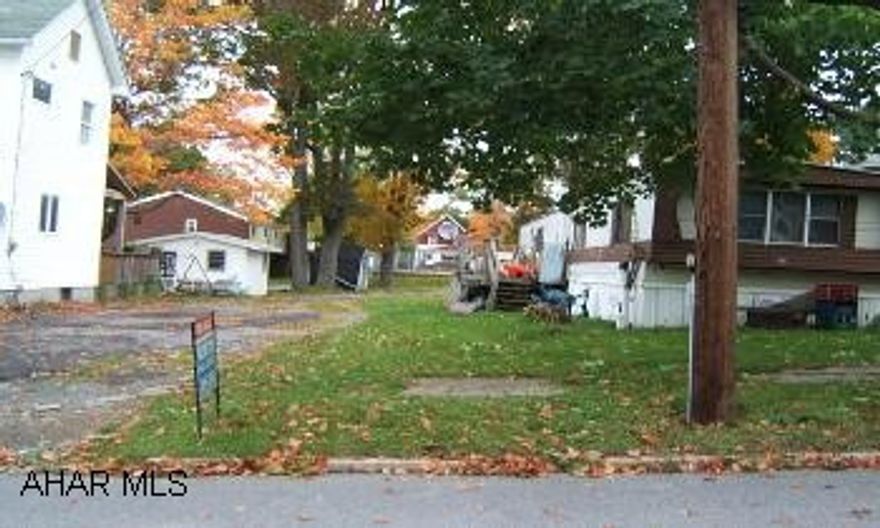 Nice lot in Cresson Borough.  Public playground across alley.  Lot includes driveway below home.