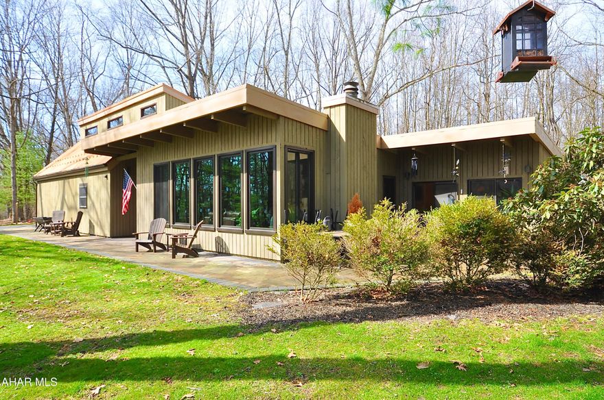 Wow! This one of a kind salt box/sprawling ranch hybrid is situate on just over 1 acre along Beaver Branch Road in Pennsylvania Furnace. Words can't really describe this incredibly beautiful home. Major upgrades include almost all new windows and skylights as well as new metal and rubber roofs and 5 new mini split heating/cooling units. Indoor heated pool! Private end of cul de sac location. Soaring trees but lots of sunlight! No one will even know you are there. See the photos and see the property in person soon. It will not last. Square footage is based on personal measurements and public records. Heated pool area included in living space as it is heated by electric baseboard as well as the pool itself. Square footage based on public records and Listing Agent measurements. Buyer Agent and Buyer to verify if desired.