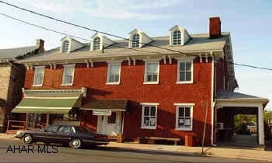 Historic Building-could be a beautiful Bed'n'Breakfast-Loads of potential!! Large side porch-attic access-dormer windows. Delayed poss.  Beautiful old historic building half was a bank otherside a residence.  Second floor right side has apartment - 2 new furnaces-vault-separate entrace.  Old staricase beautiful 2nd floor apartment 2 baths.