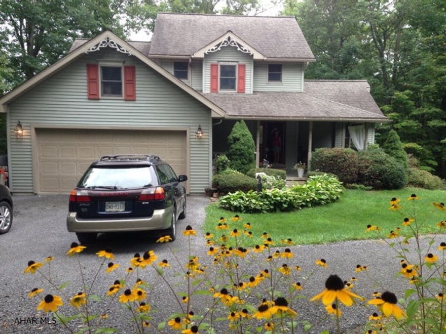 Exceptional built 3 BR, 3.5 BA, 3 car garage home in desirable Ridgewood Heights within 1/2 mile of Chestnut Ridge Middle and High Schools. Solid wood floors and gorgeous crown mouldings are found throughout. A 2-story central foyer opens onto a 2-story family room w/ impressive floor to ceiling stone fireplace. Main floor laundry and master suite w/ huge walk-in closet, tray ceilings and designer bath. Second floor bedrooms each have French doors leading to private decks and huge walk-in closets. Sunny lower level has bedroom/office, 3/4 bath, laundry and family room w/ walkout French doors. Home is surrounded by trees and extra lot available for sale.