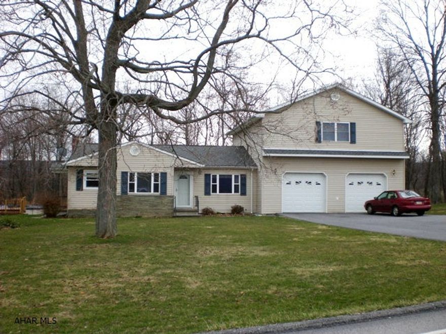 Immaculate split level home on 1.274 acres. LR, kitchen w/ custom oak cabinets, 1st floor laundry, 2 full BA & 3 BR. Heat pump w/ central air, thermo pane windows, 200 amp electric, & 28' x 30' garage. Oak trim & new addition in 2004. Macadam driveway & terrific country views. This is a really nice property!