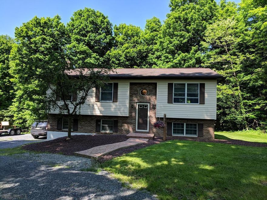 Looking for an exceptionally clean, updated, and move-in ready home in the woods? Here's your chance to own almost 2 acres with 4 bedrooms, 2 bathrooms and 2 large living areas! Nice curb appeal and large yard with lots of privacy. Included on this property is a large, 16'x15' deck, and a 23'x15' stamped concrete patio!  The current owners have done over 40k in renovations to make this property perfect for you to call it your own! Call a Realtor today for a tour of this property!