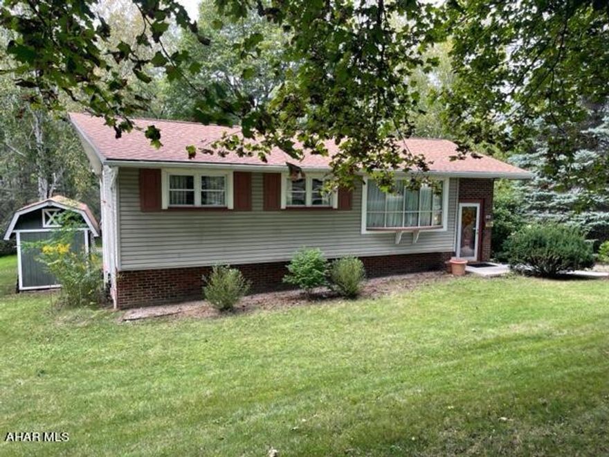 Super home on large private lot in Altoona.  The lot is .69 acres and amazing. Home has 3 bedrooms, a full bath and a 3/4 bath on the main floor. Beautiful Original Oak hardwood floor, Oak trim and doors. Meticulously maintained. Mechanics of the house are solid. Newer windows. Hot water tank, furnace and AC updated in the last 6 years. Wiring updated. Basement is partially finished with a wood burner to help with the heating costs and plenty of storage. The back of the home is completely private. There is a covered patio for sitting out in the evenings. One car garage plus a carport. Don't miss the huge Pavillion on the property! So many uses for this building!! Please remove shoes.