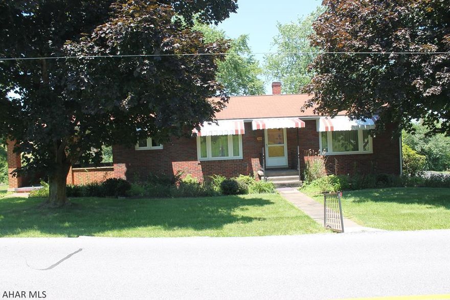 Come and take a look at this classic brick home in Hollidaysburg! beautiful Hardwood floors and trim with carpeted bedrooms. A Covered Porch surrounded in warm brick will be your favorite spot to relax on a nice day. This home also features a large backyard and a shed! Kitchen and Bathrooms need updates, but it is the perfect blank canvas for your dream home! Another parcel included..