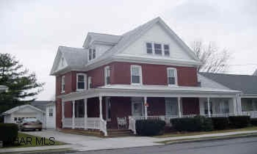 One block from park. Spacious brick colonial two story.  Two garages.  Enclosed porch.  Lovely two story brick colonial with four bedrooms, one & 1/2 baths, family room, one car garage, two car garage, first floor laundry.