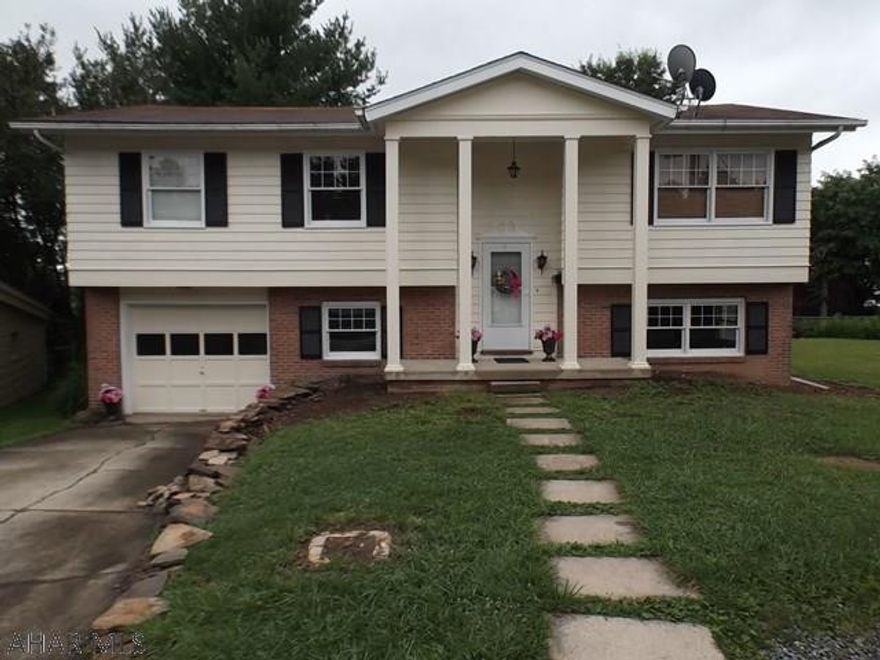 Spacious split entry in Eldorado.  Beautiful hardwood floors on first level, deck off dining room, large family room with bar that can be moved to your desired location in the room.  Freshly painted and ready to occupy.  One year home warranty.  Convenient to shopping, bus stop, and I-99.  Listing agent is related to owner.